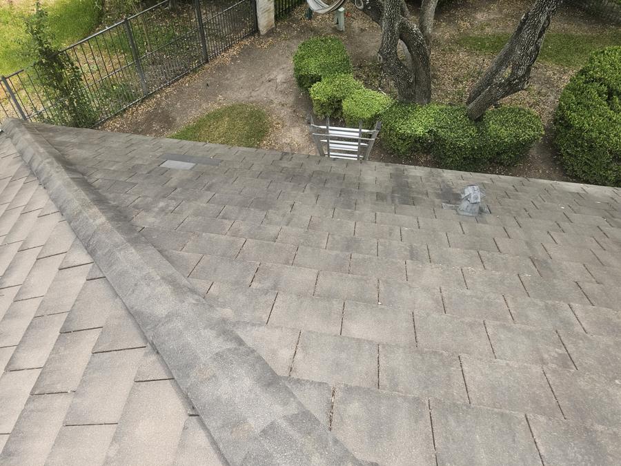 Concrete tile roof with dark streaks and staining